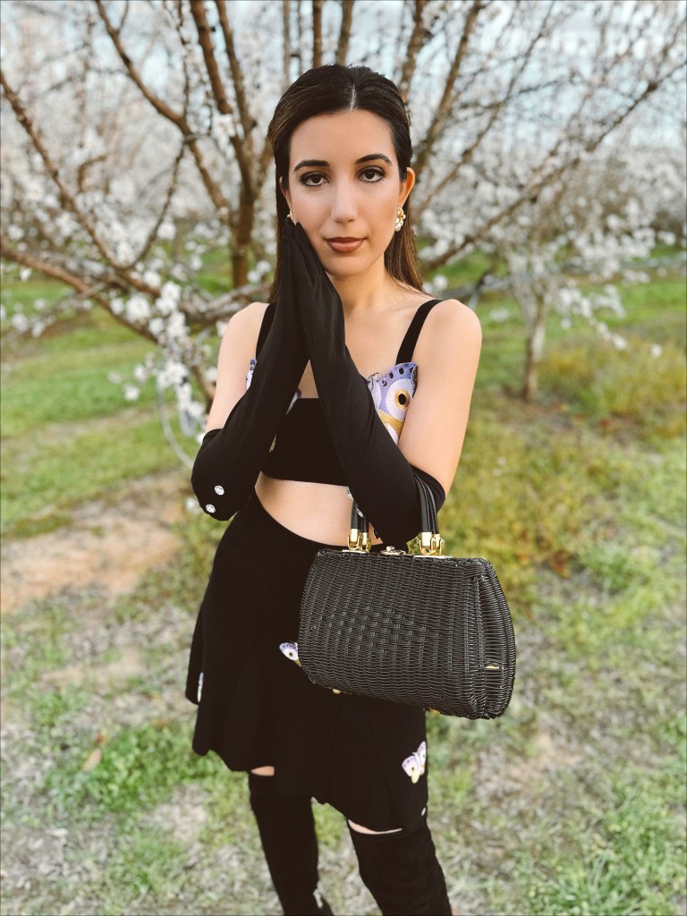 Autumn Adeigbo, knitwear, crop top, butterfly top, vintage earrings, opera gloves, spring 2023 fashion trends, fashion month, couture week, Paris fashion week, Milan fashion week, runway, wicker bag, vintage purse, suede boots